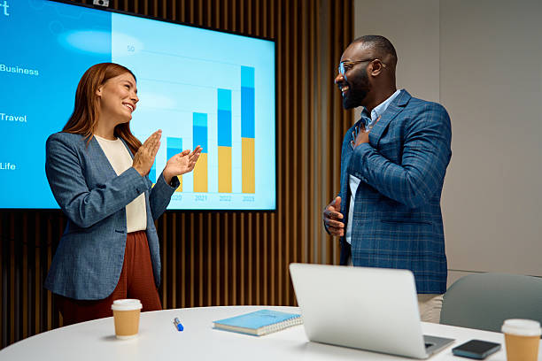 istock Business colleagues celebrating project success after presentation 2240545071