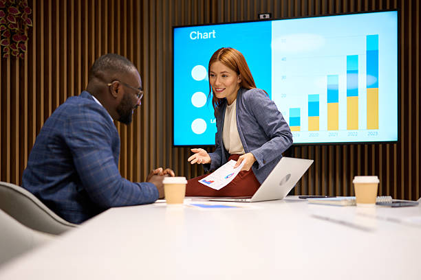 istock Analyzing charts, business people discussing data in office 2240545212