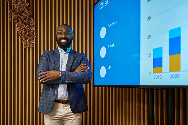 istock African American confident businessman standing in office presenting financial chart 2240545245