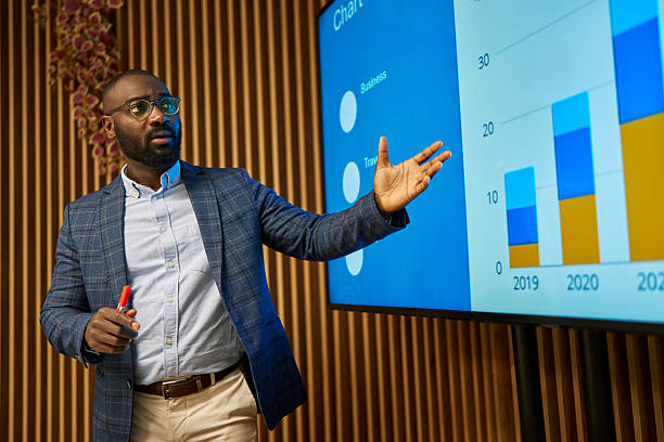 istock African american man presenting business data showing annual growth 2240545252