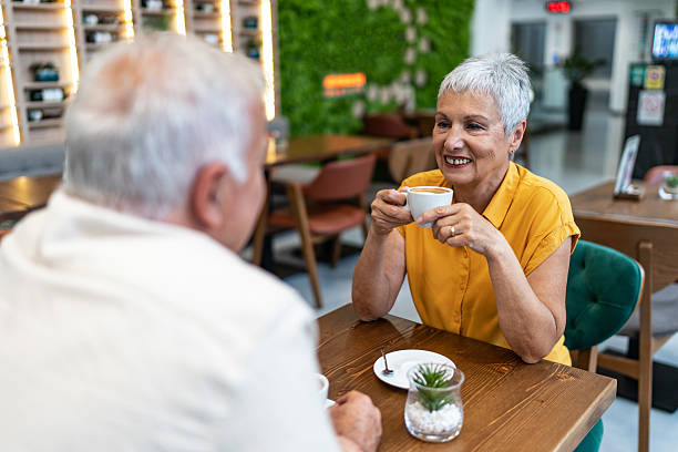 istock Senior couple enjoying coffee during a date at cafe 2240546701