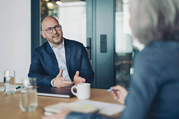 istock Businessman talking to a colleague 2240547003