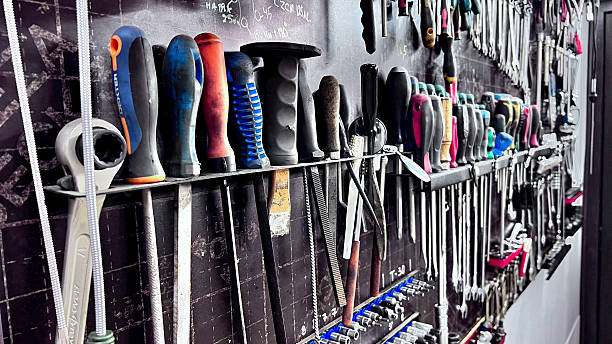 istock A close-up view of a wall filled with various mechanic tools, including wrenches. 2240549005