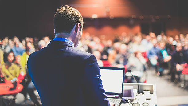 istock Public speaker giving talk at business event. 2240549010