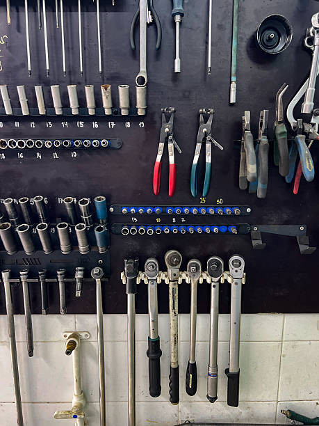 istock A collection of various mechanic tools organized on a wall. 2240549197