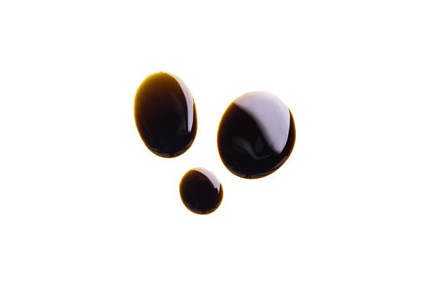 istock Old engine oil drip stains isolated on white background 2240550499