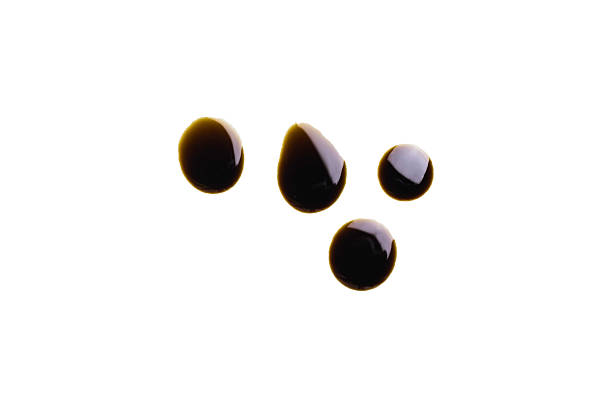istock Old engine oil drip stains isolated on white background 2240550505