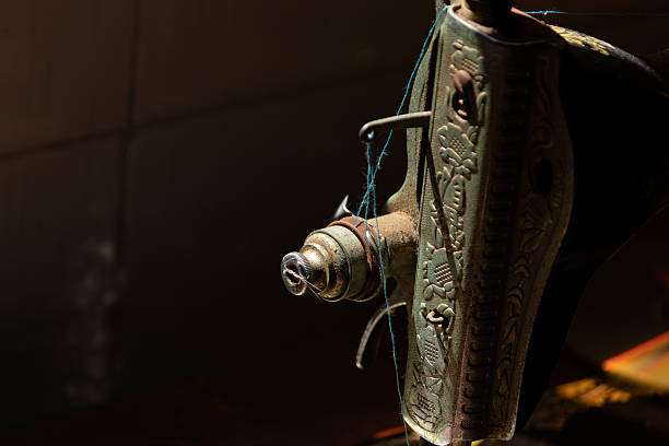 istock Dramatic still life of a vintage sewing machine. 2240552178