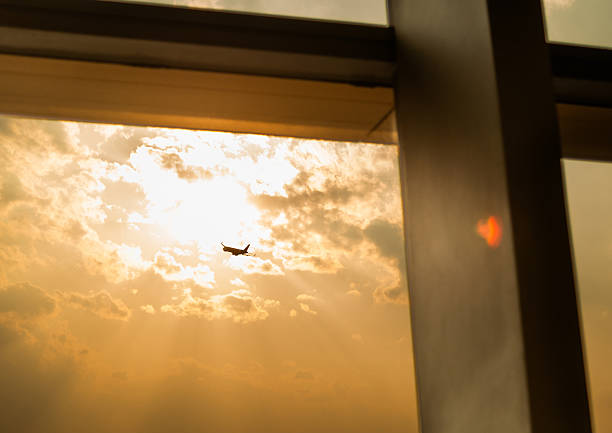 Sunset view of airplane flying from the window