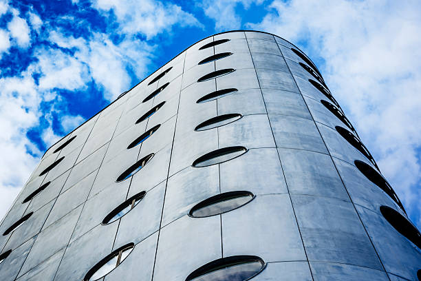Abstract view of the facade of a modern residential building in the Sluseholmen area of Copenhagen. An area that has seen a massive regeneration and development for business and private homes, all featuring a variety of contemporary architectural styles. On this building, a variety of materials and shapes have been used to create a distictive profile for the building.