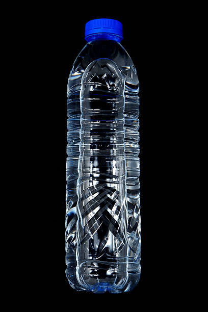 istock Drinking water bottle isolated on black background close-up view flat lay photography 2240562239