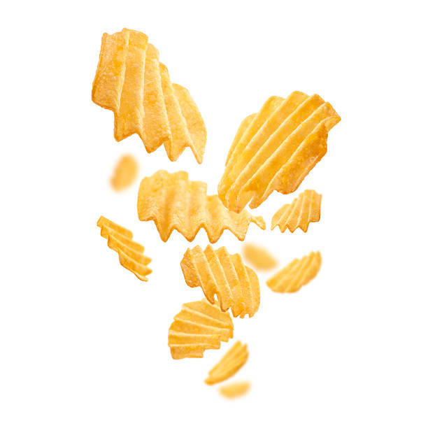 istock Fluted potato chips levitate on a white background 2240563085
