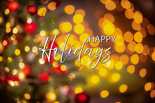 istock Happy Holidays greeting card on defocused Christmas lights at background 2240563677