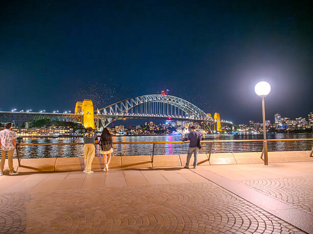 11 October 2025 Harbour Bridge at Circular Quay on Sydney Harbour illuminated at night on a spring cool night in Sydney NSW Australia
