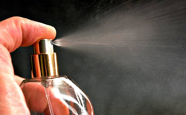 istock Perfume spray close-up with fine mist. 2240566753