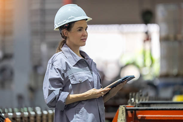 istock Female worker using tablet in manufacturing plant modern industrial environment focused viewpoint efficiency in operations 2240568911