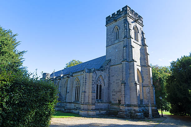 A historical church built with stone, blue sky background, close up, vertical image.