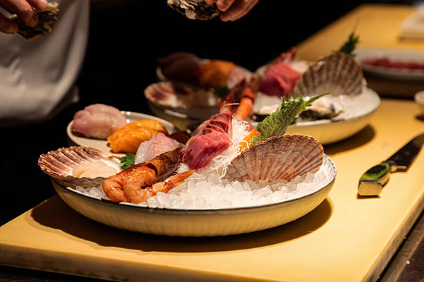 istock Fresh seafood platter with assorted sushi and shellfish on ice 2240569516