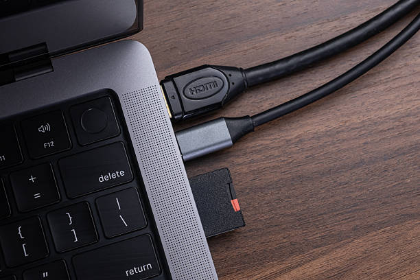 istock Modern laptop connected to an HDMI cable and an SD card via a versatile multi-port USB-C hub for enhanced digital connectivity and seamless data transfer 2240575934