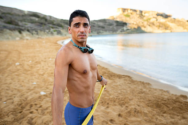 The man in thermal foam does water sports in the sea
