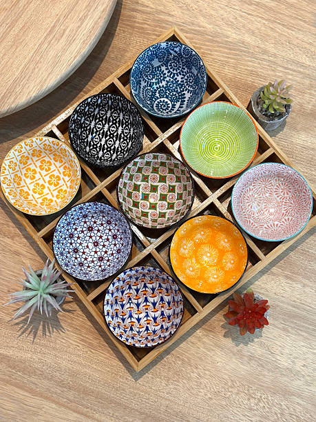istock Colourful Ceramic Bowls in Wooden Grid Display 2240578867