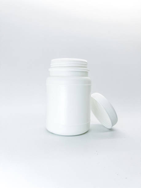 istock Sterile White Pill Bottle With Open Neck and Detached Cap on Clean White Surface 2240579685