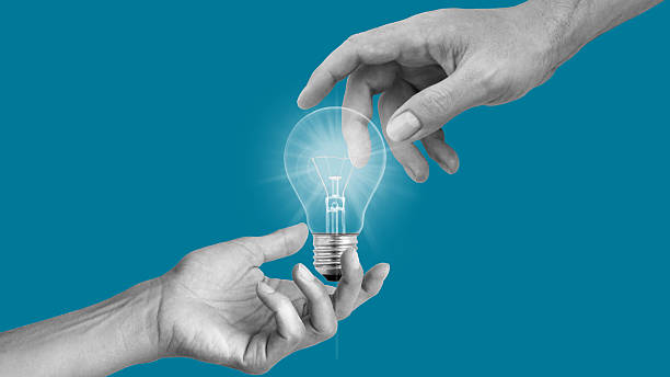istock Human hands over lightbulb symbolizing generation of creative business ideas. Brainstorming. Concept of business, career, creativity, growth 2240582111