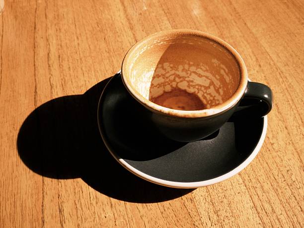 A cup of cappuccino coffee that has been finished