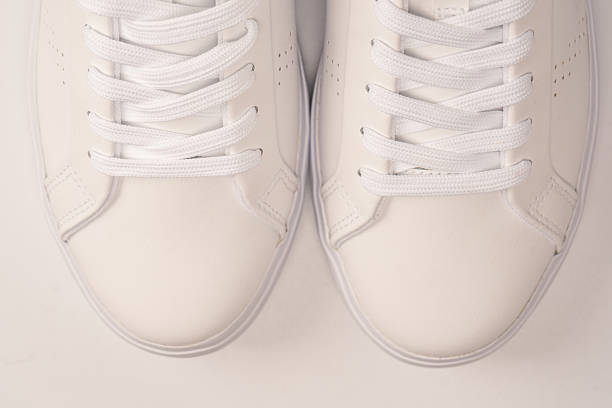 istock White leather sneakers isolated on white background. 2240584879