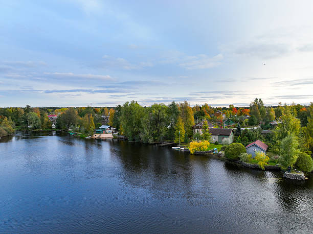 istock River and rural houses surrounded by autumn trees 2240586456