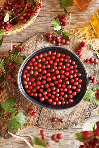 istock Making medicinal wine with fresh hawthorn berries 2240589917