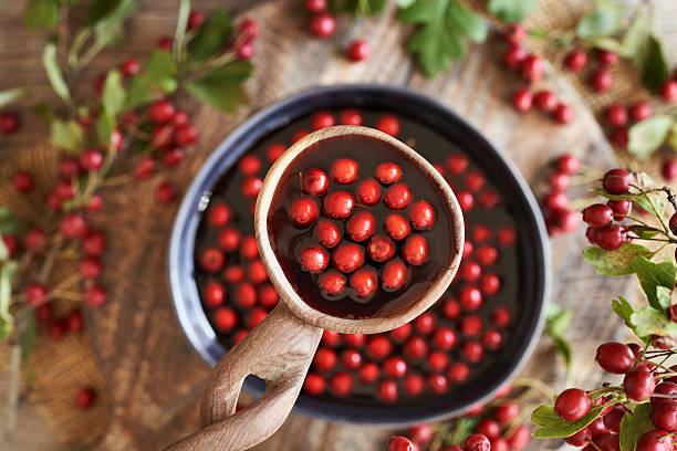 istock Preparation of medicinal wine from fresh hawthorn berries 2240589921