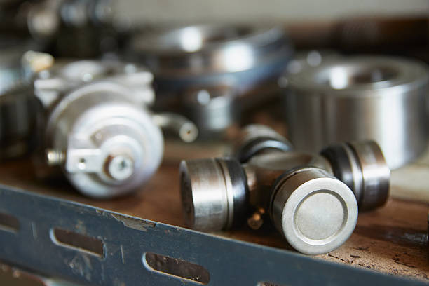 Right Frame Mechanical Engineering or Industry Concept by Old Universal Joint and Auto Part Like Ball Bearing on Shelf