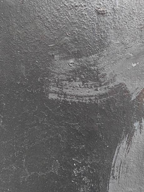 istock Old concrete wall with weathered stains and rough texture. Use as a background, grunge texture, or design element representing decay, urban environments, or industrial themes 2240596866