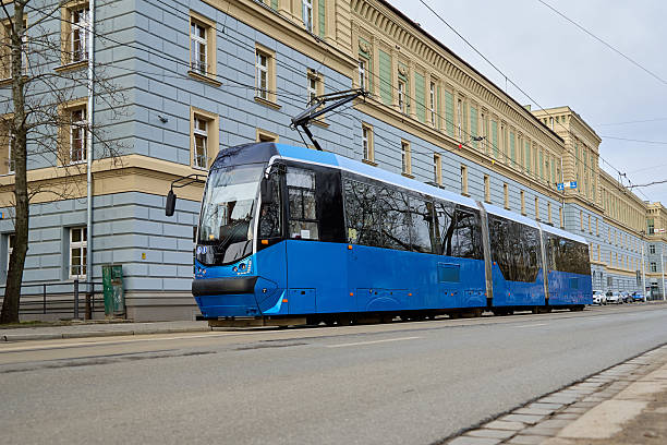 istock Modern blue tram on city street 2240600881