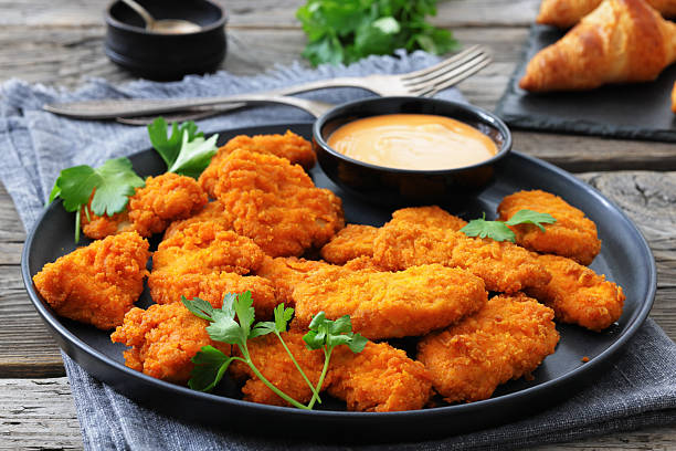 istock breaded chicken breast chunks with dipping sauce 2240601956