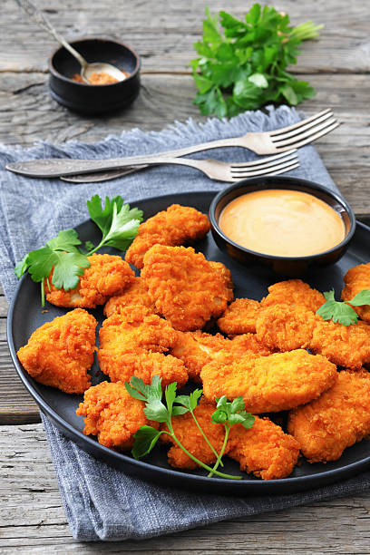 istock breaded chicken breast chunks with dipping sauce 2240602293