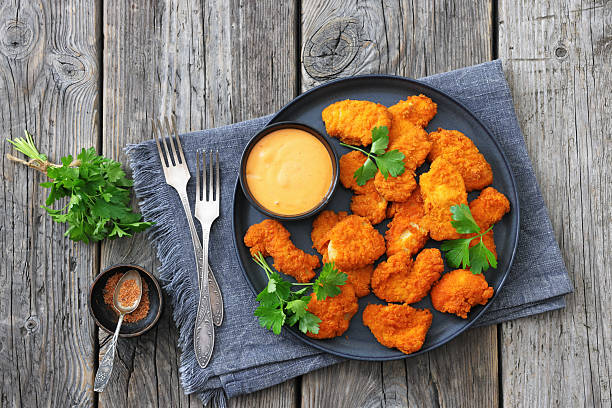 istock breaded chicken breast chunks with dipping sauce 2240602589