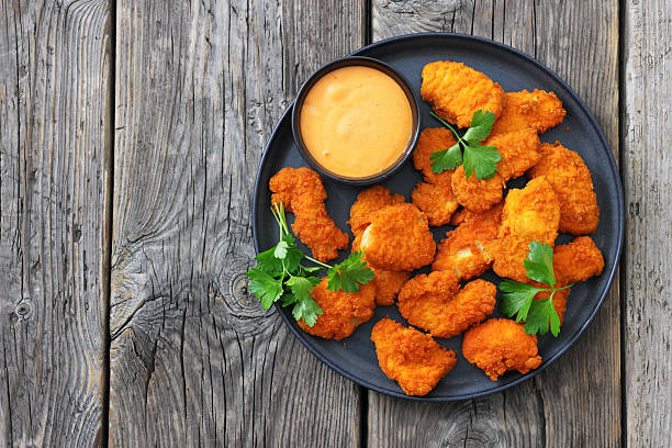 istock breaded chicken breast chunks with dipping sauce 2240603320