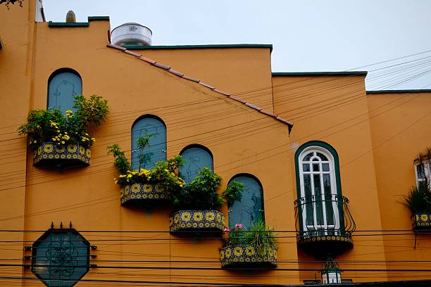 istock Offbeat Orange Apartment Building with Arched Windows (Mexico City, Mexico) 2240605533