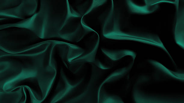 istock Luxurious cold dark blue fun british racing emerald green silk fabric with elegant, flowing drapes and soft sheen. Premium satin cloth texture for business. Sleek bedding, sheet. Shiny folds 2240605821