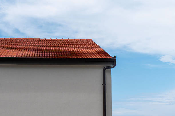 istock Terracotta roof with black gutter downpipe 2240611065
