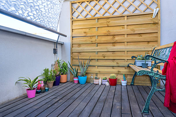 istock Plants are essential elements for infusing life, color, and freshness into any wooden deck 2240611513