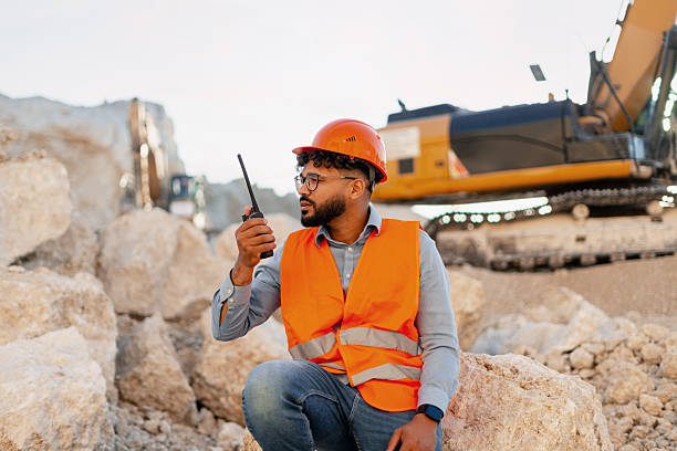 istock Professional middle Eastern Construction engineer communicating via walkie-talkie at worksite 2240612328