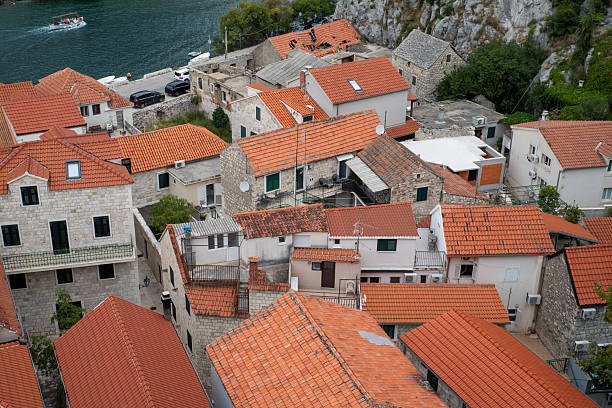 Terracotta rooftops above old stone houses