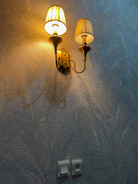 istock Wall Sconce with Dual Lamps on Textured Wall 2240616033