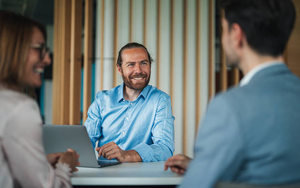 istock Confident team leader leading a discussion in a modern office 2240616589