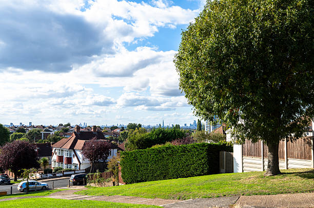Residential houses in the London Borough of Greenwich overlooking distant city skyline, England
