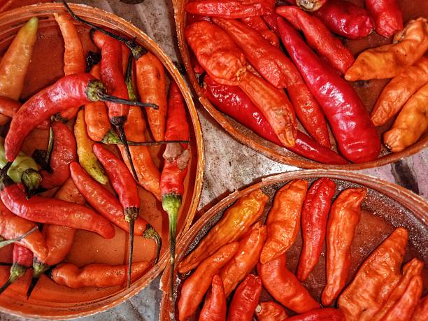 a collection of slightly dried red chilies