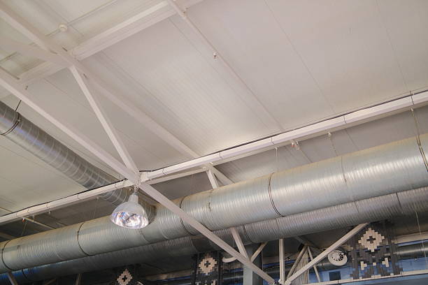istock White ceiling with industrial metal pipes and support structures 2240625660